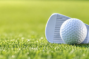 Golf club and ball on green grass, s, a Photo by Dvoevnore photos