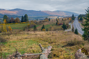 Cloudy autumn Carpathian Mountains and highway on mountain pass,, a Nature Photo by YuriyB