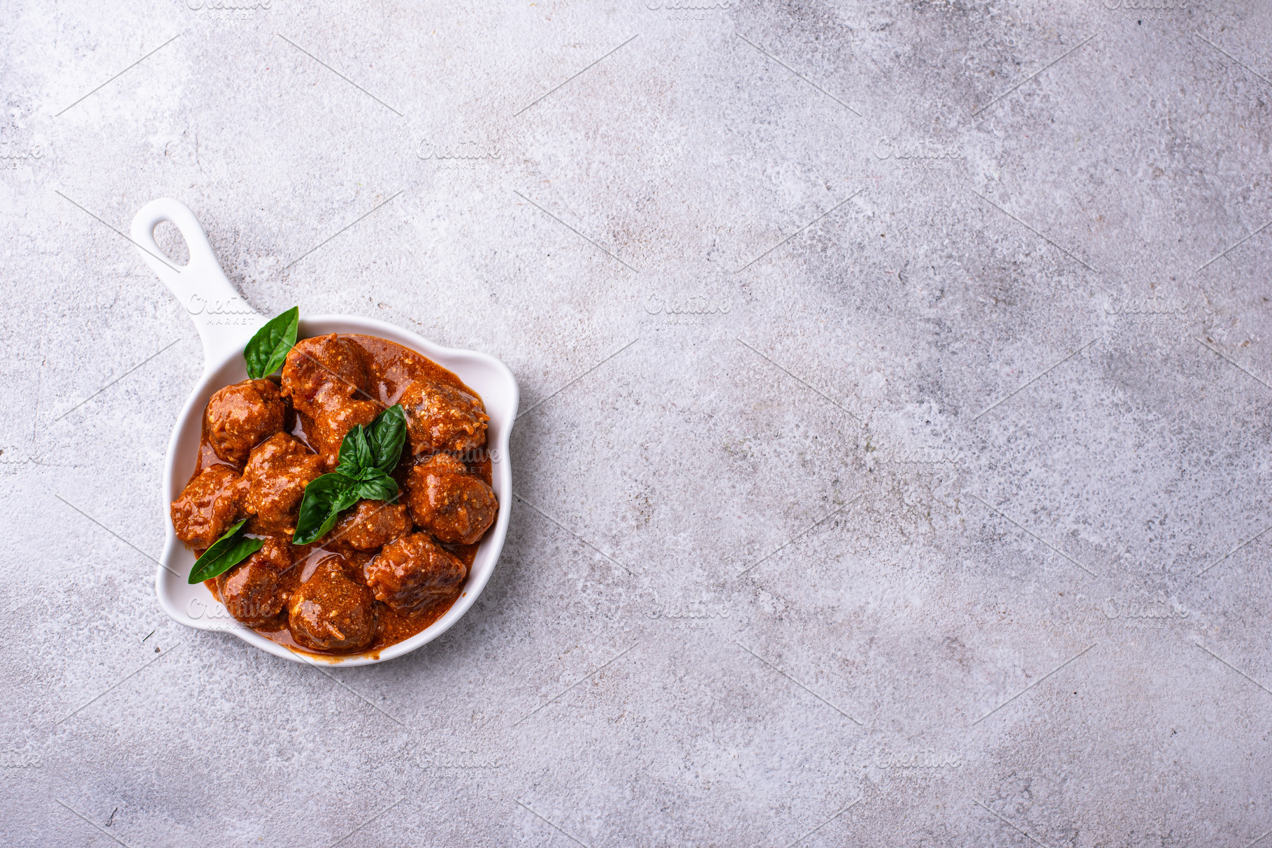 Homemade meatballs in tomato sauce, a Food & Drink Photo by Yulia Furman