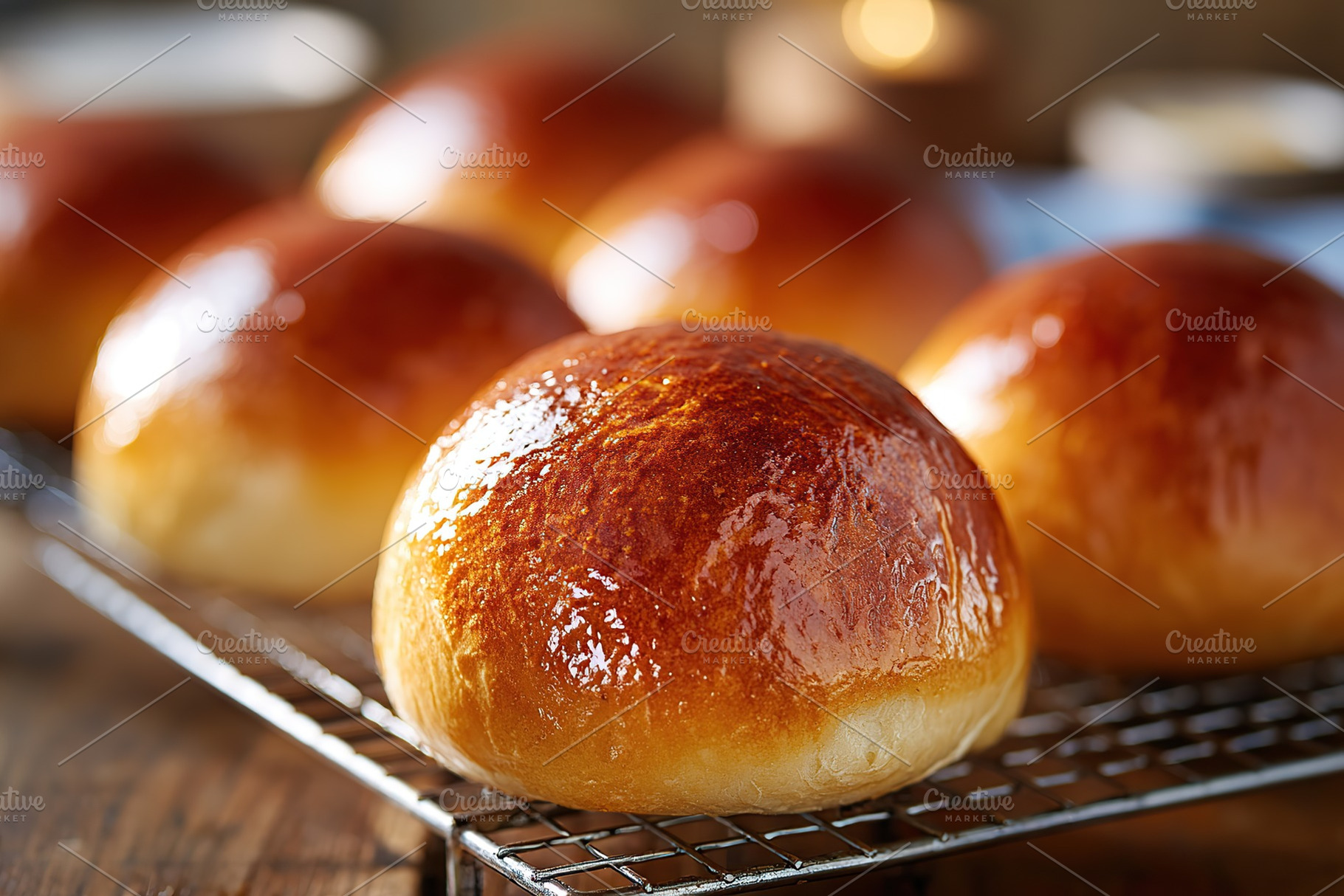 Freshly baked brioche buns with glossy egg wash on cooling rack, a Food & Drink Photo by AlyaAnd