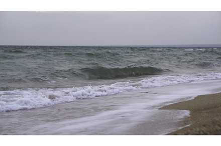 Waves crashing on the sand at a, a Nature Photo by Media Whale Stock