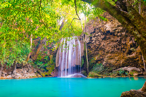 Tropical waterfall with emerald lake in jungle forest, a Nature Photo by Vapi