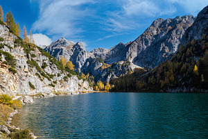 Sunny autumn alpine Tappenkarsee lake and rocky mountains above,, a Nature Photo by YuriyB