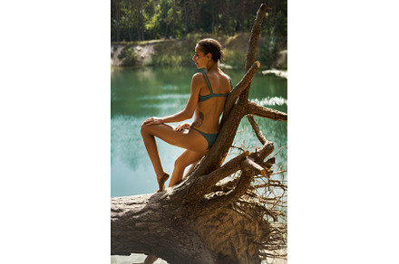 Suntan Bikini Model Relaxing by the