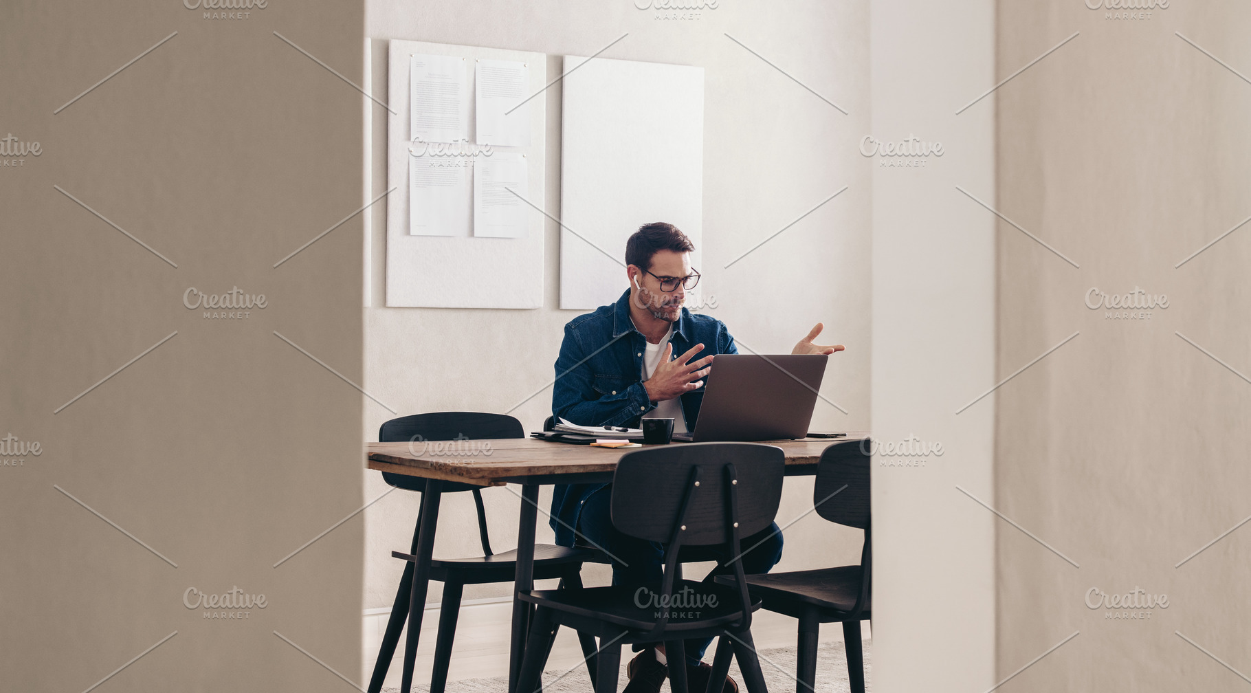 Young businessman speaking during a video conference, a Person Photo by Jacob Lund