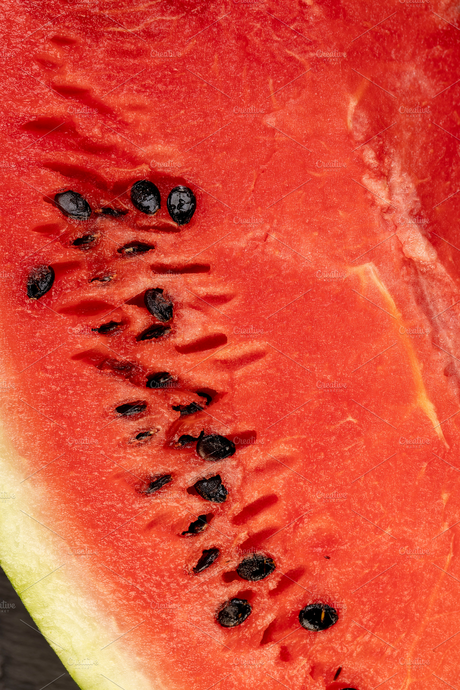 watermelon with pits, part of a sliced juicy watermelon with black seeds, close, a Photo by rsoollAI