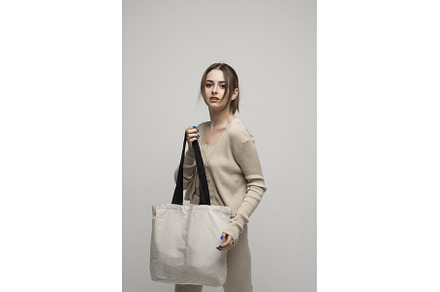 Brunette young girl holding linen, a Person Photo by volodymyrshtun13795