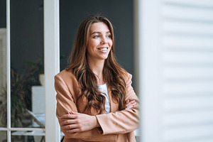 Young businesswoman near window