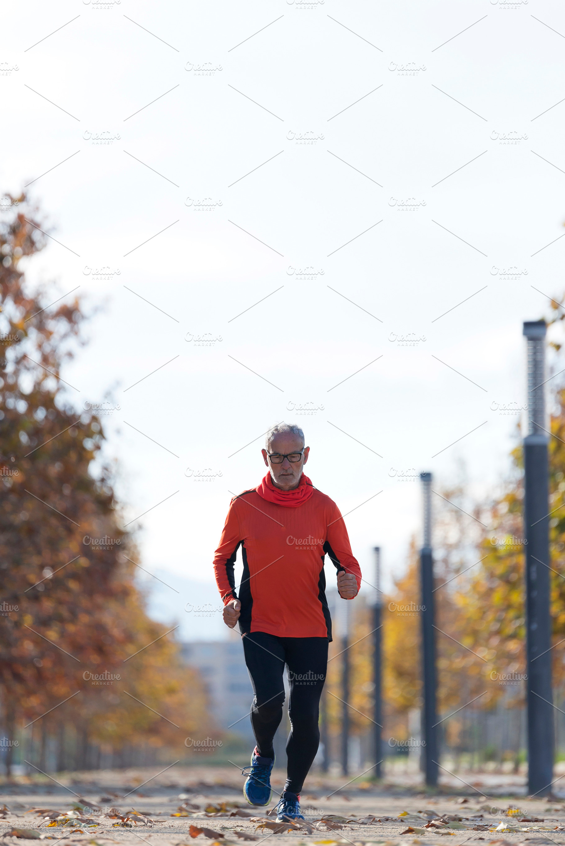 Senior man running outdoors in sportswear, a Sports & Recreation Photo by RF Images