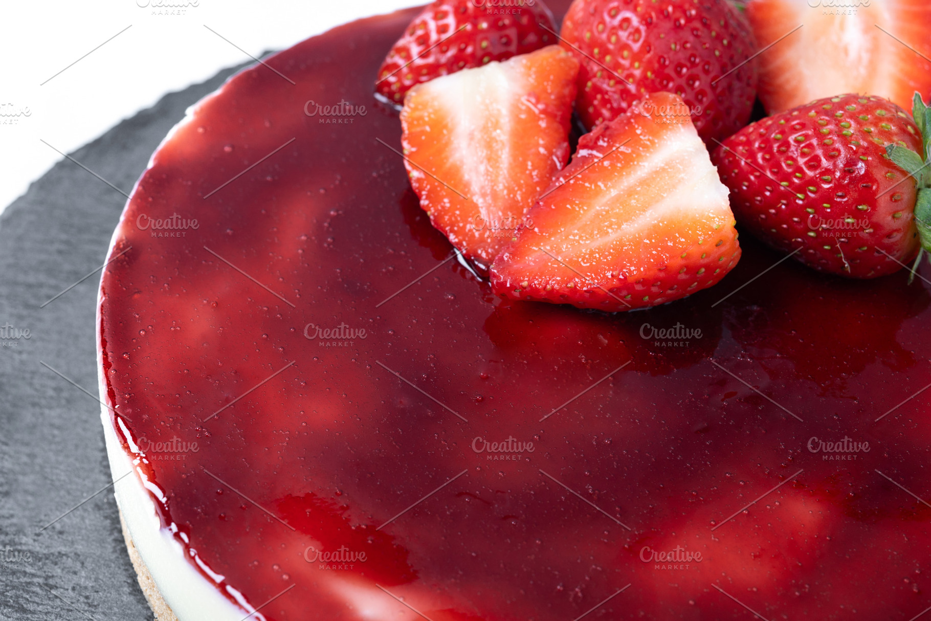 Cheesecake with strawberries isolated on white background, a Food & Drink Photo by etorres69