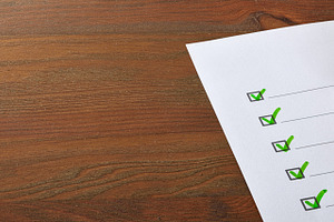 Completed Checklist on Wooden Desk, a Business Photo by Davizro's Market
