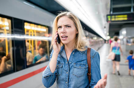 Woman making phone call at the underground platform waiting stock photo, a Person Photo by HalfPoint