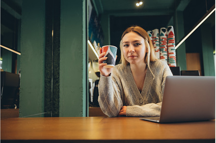 Girl working at her laptop sitting, a Person Photo by zheckasmk