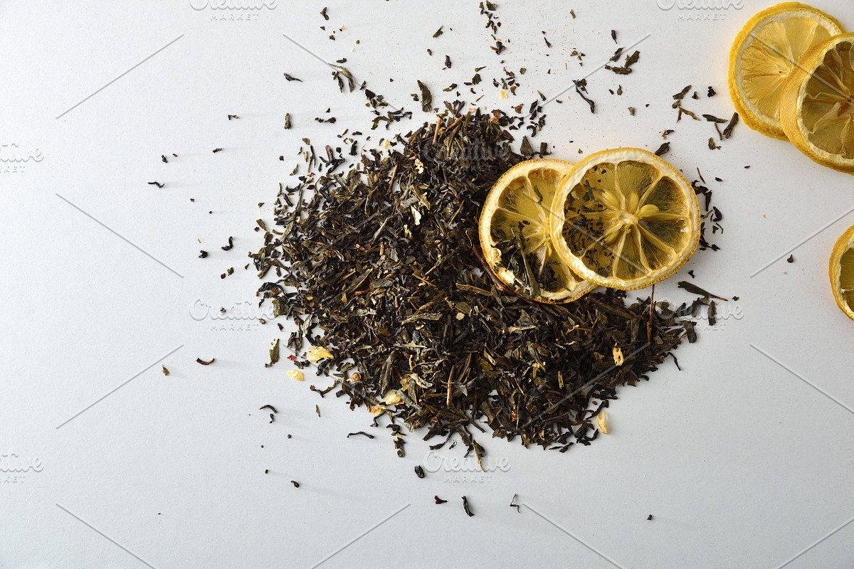 Detail of tea leaves on white table with lemon slices, a Food & Drink Photo by Davizro's Market (Photo 1 of 2)