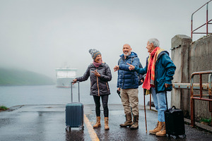 Senior travelers waiting for a ferry at a remote terminal in bor