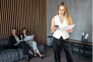 Businesswomen reviewing documents, a Business Photo by undrey