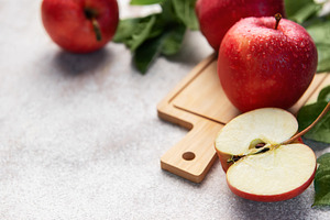 Red apples and a cut apple slice, healthy eating, a Food & Drink Photo by Olena Rudo