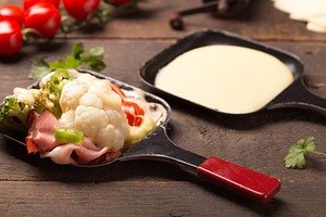 Healthy ingredients for raclette containing raclette, broccoli, and cheese