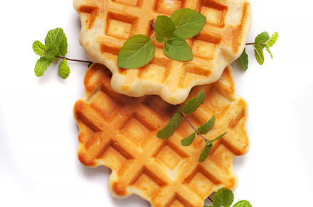 Homemade freshly baked belgian waffles isolated on white backgro