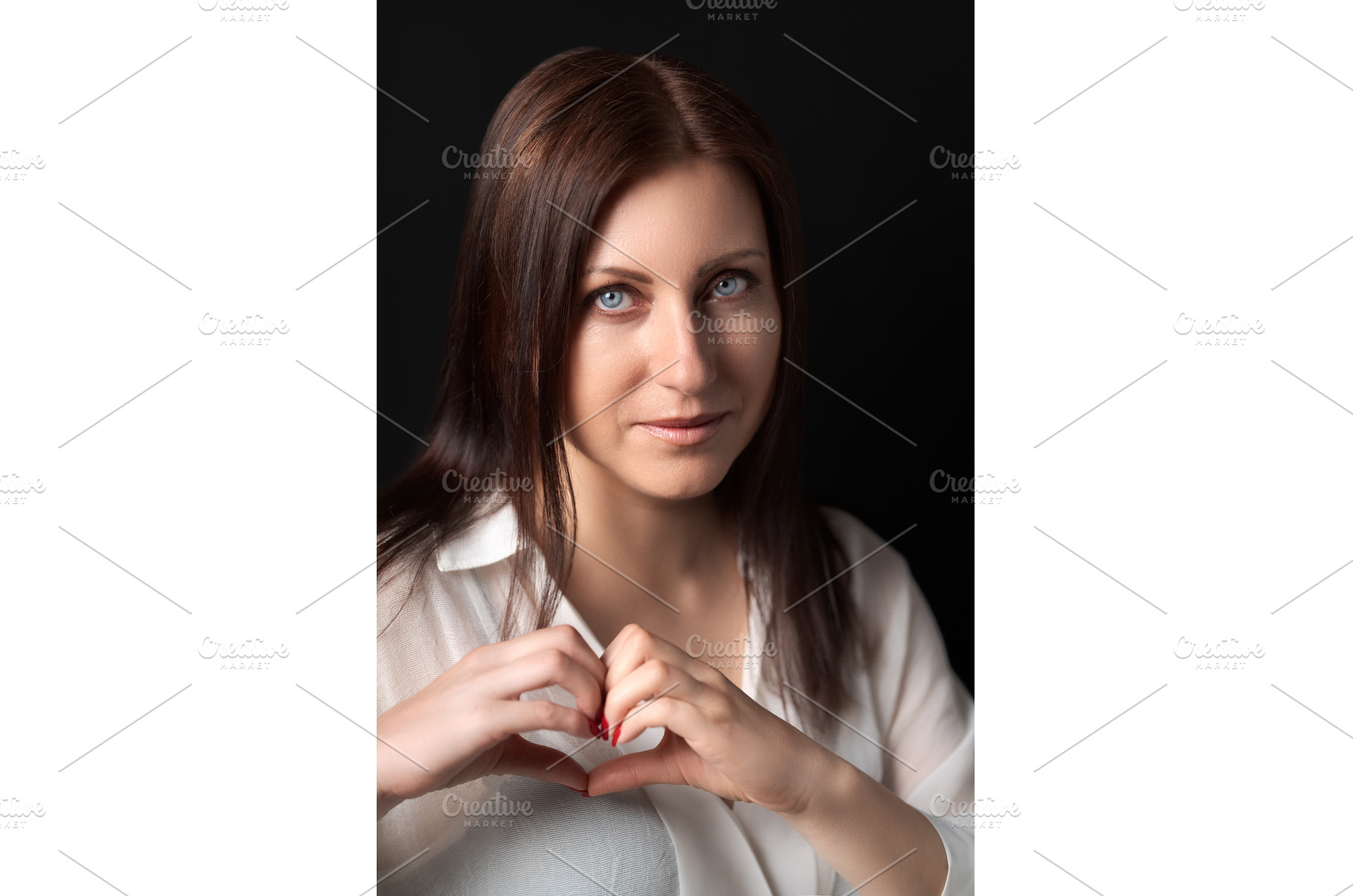 Portrait of woman showing heart, a Person Photo by Alexander-Piragis