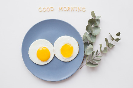 two beautiful eggs on a plate, a Food & Drink Photo by Artsaba Family
