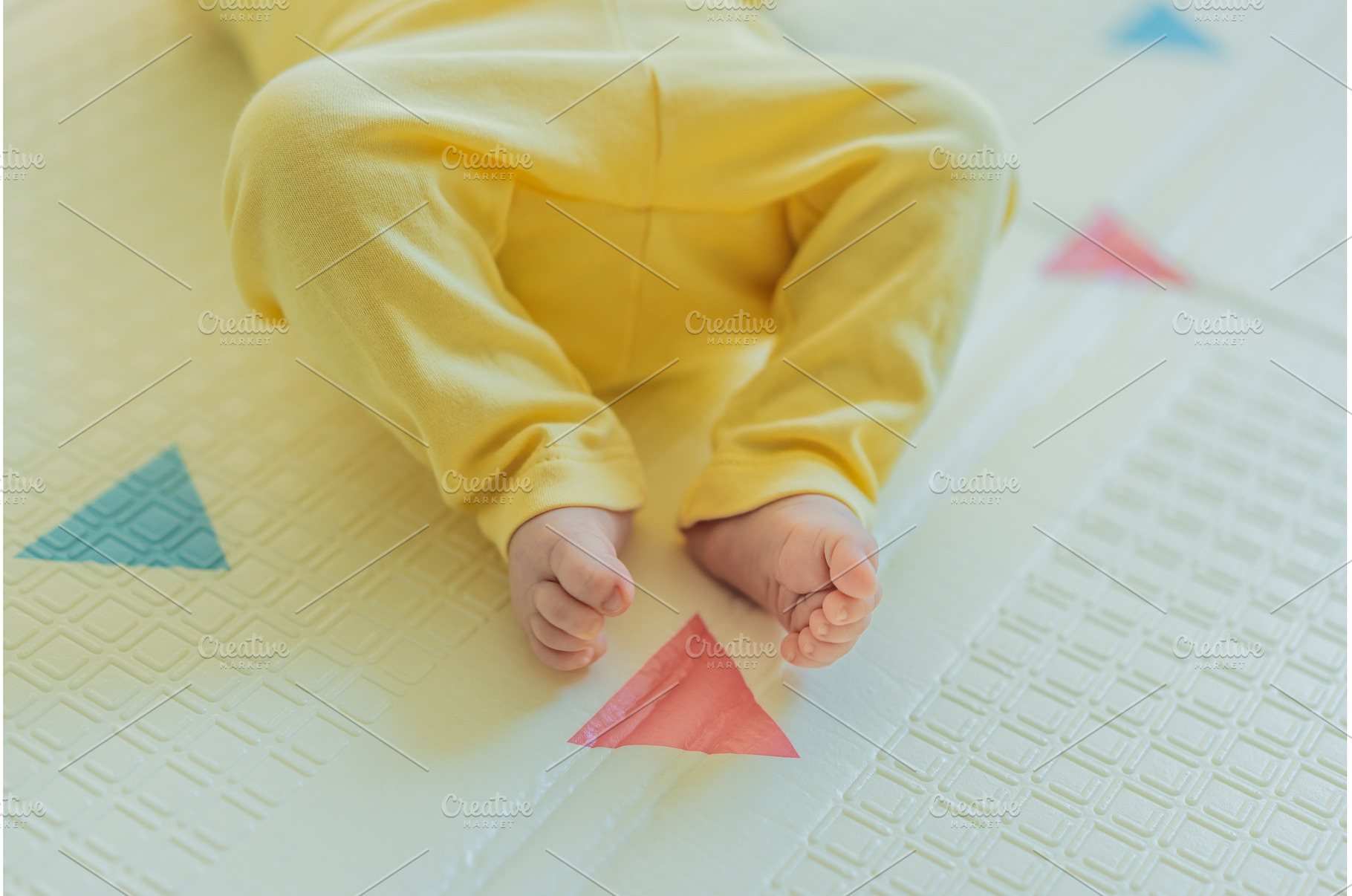 Adorable baby in a yellow hat lying, a Beauty & Fashion Photo by Elizaveta Galitskaya