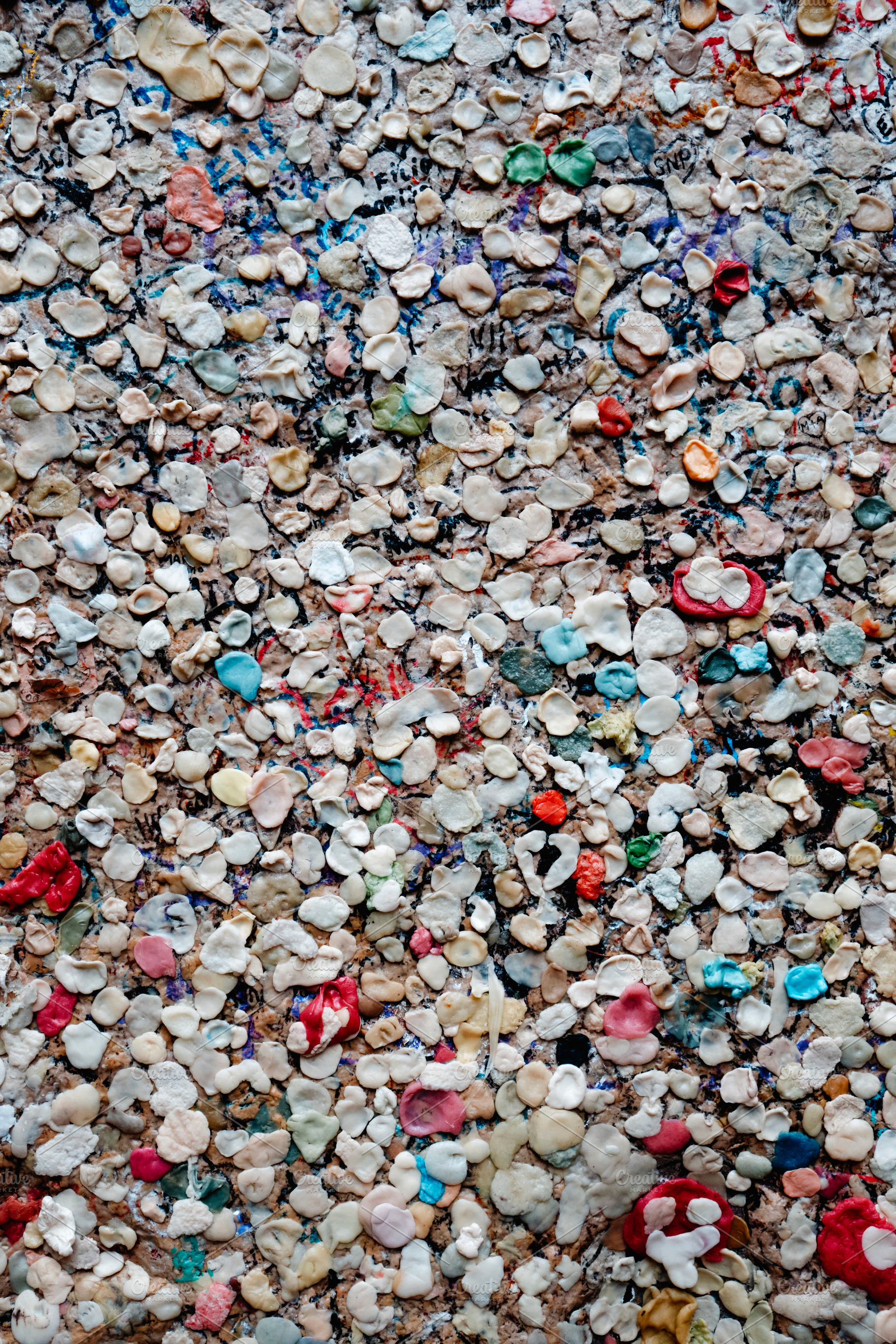 wall covered with colorful chewing gums, a Photo by Nito