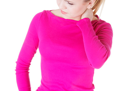 Young casual woman is touching her neck stock photo containing pain and