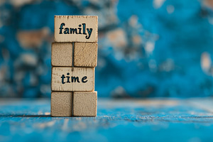 Wooden blocks spelling family time stacked on blue background, an Abstract Photo by Natalia Klenova's Shop