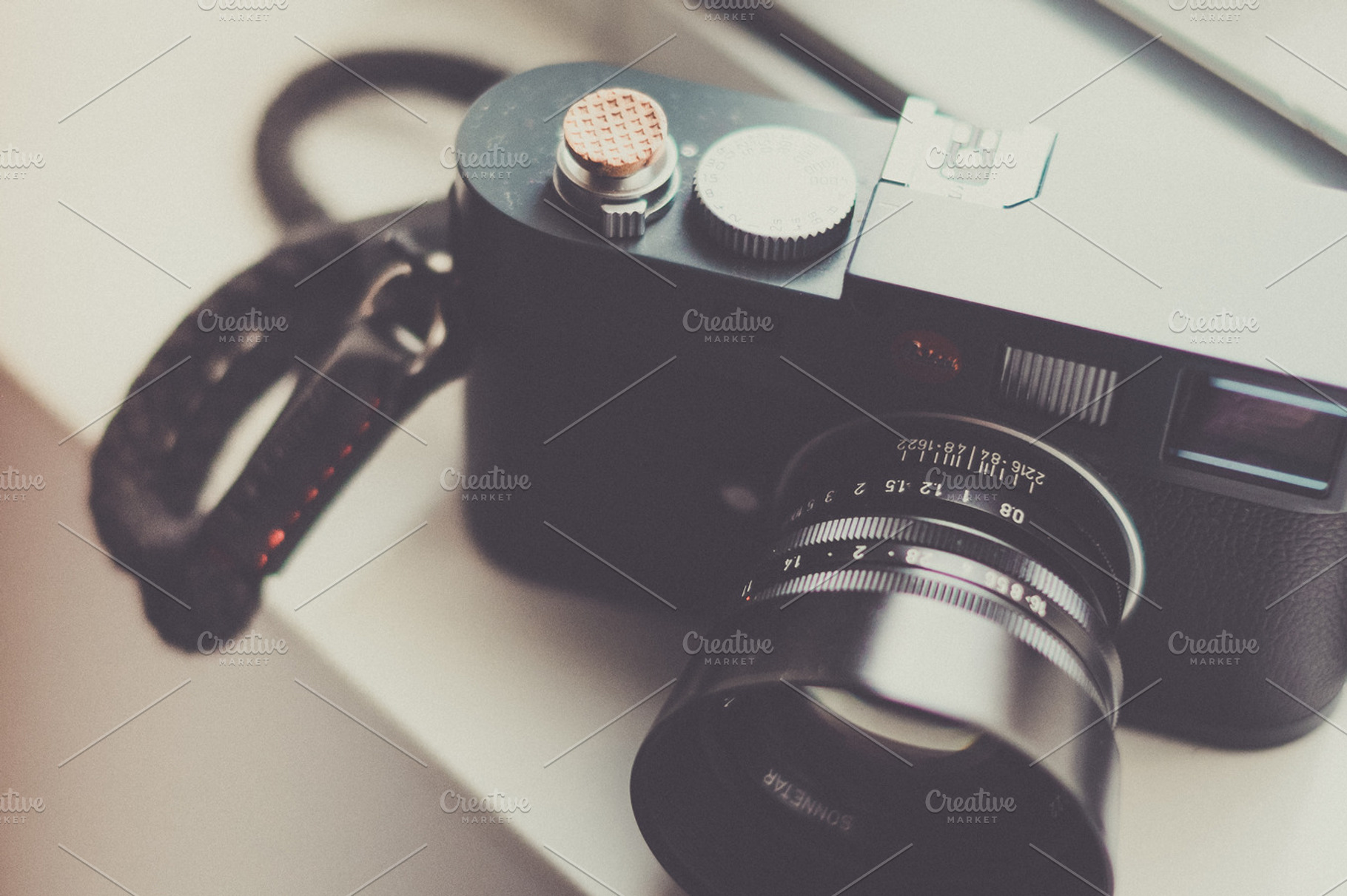 Camera containing wood, camera, and lens, an Industrial Photo by The Kandid