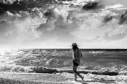 Woman on the beach stock photo containing beach and woman, a Person Photo by Olezzo