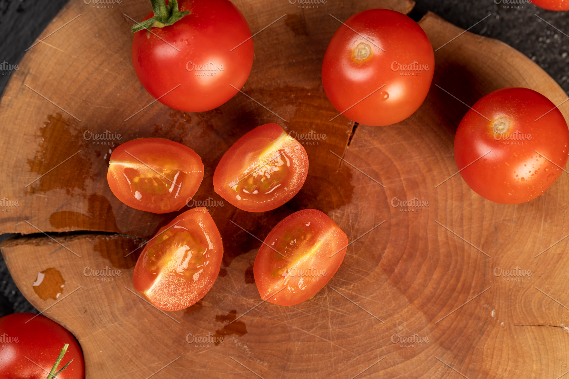 cut tomatoes sliced on a board, several ripe red tomatoes during slicing for co, a Photo by rsoollAI