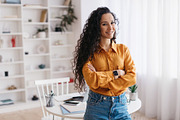 Brunette Lady Crossing Hands Smiling To Camera Standing Indoor, a Photo by Prostock-Studio (Thumbnail 2 of 3)