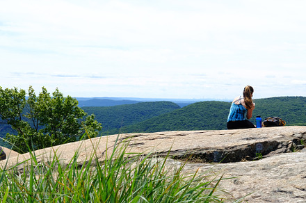 Girl resting on top of a mountain, a Person Photo by OF Media