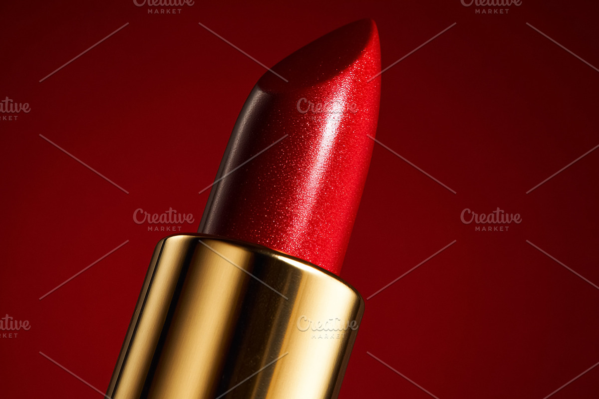 Red shimmering lipstick tube presenting glamour and elegance for, a Beauty & Fashion Photo by Studio ANNA (Photo 2 of 2)