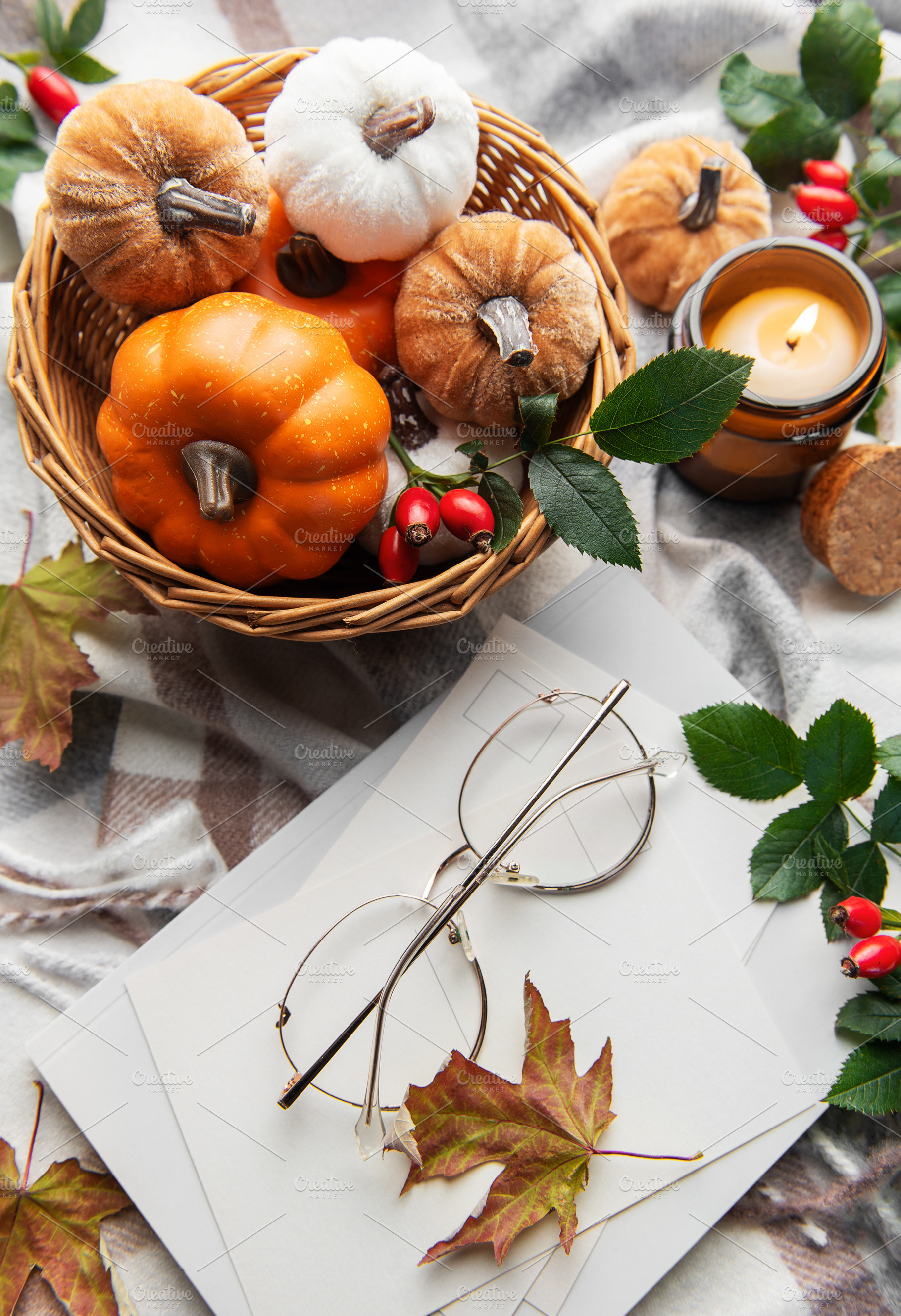 Autumn flat lay with pumpkins, candle, and warm blanket, a Holiday Photo by Olena Rudo