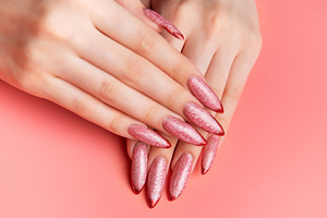 Woman showing stiletto pink and red ombre nails, a Beauty & Fashion Photo by Olena Rudo
