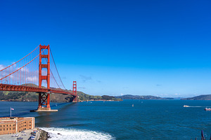 Golden Gate Bridge over blue waters with scenic hills in San Fra, a Nature Photo by GoodGoods