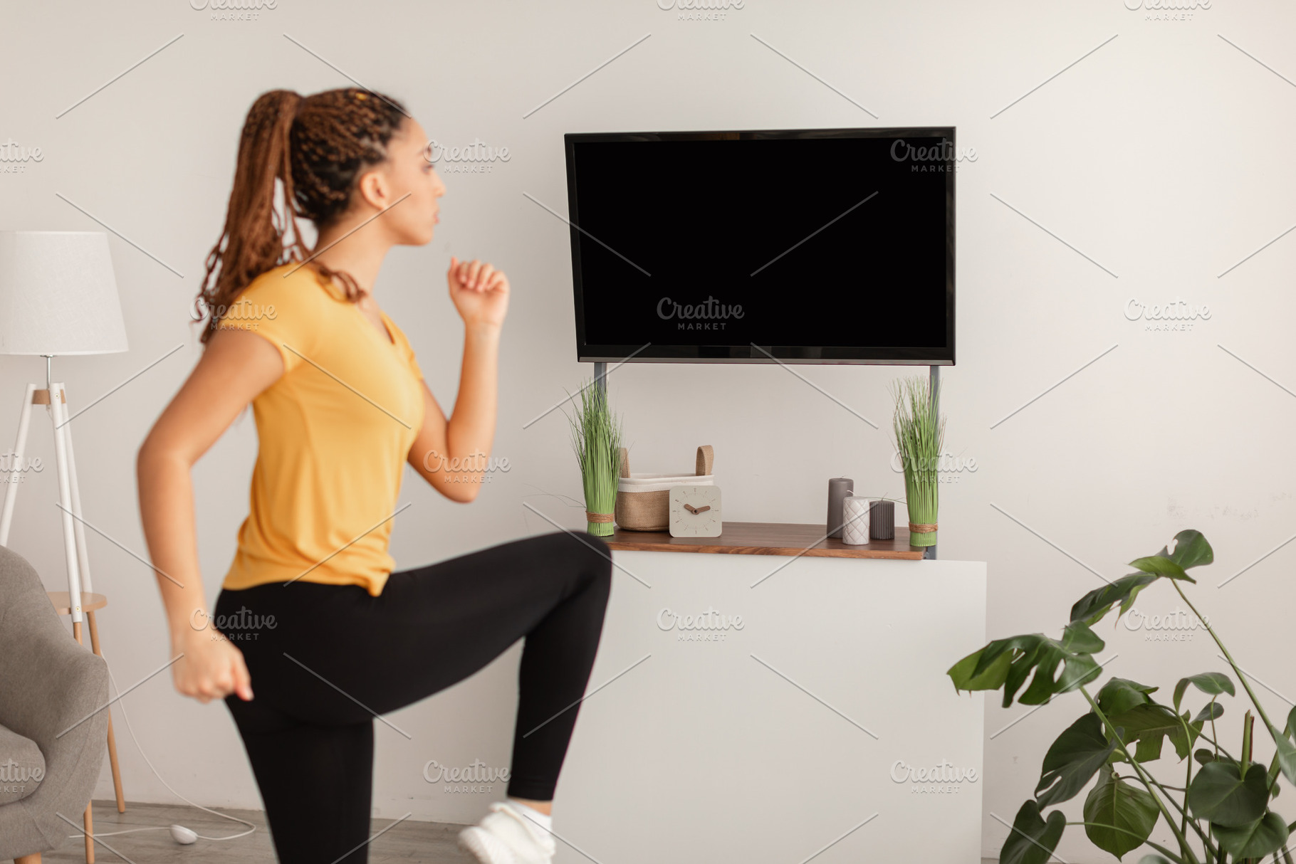 Sporty Woman Doing Leg Exercise During Workout At Home, a Photo by Prostock-Studio