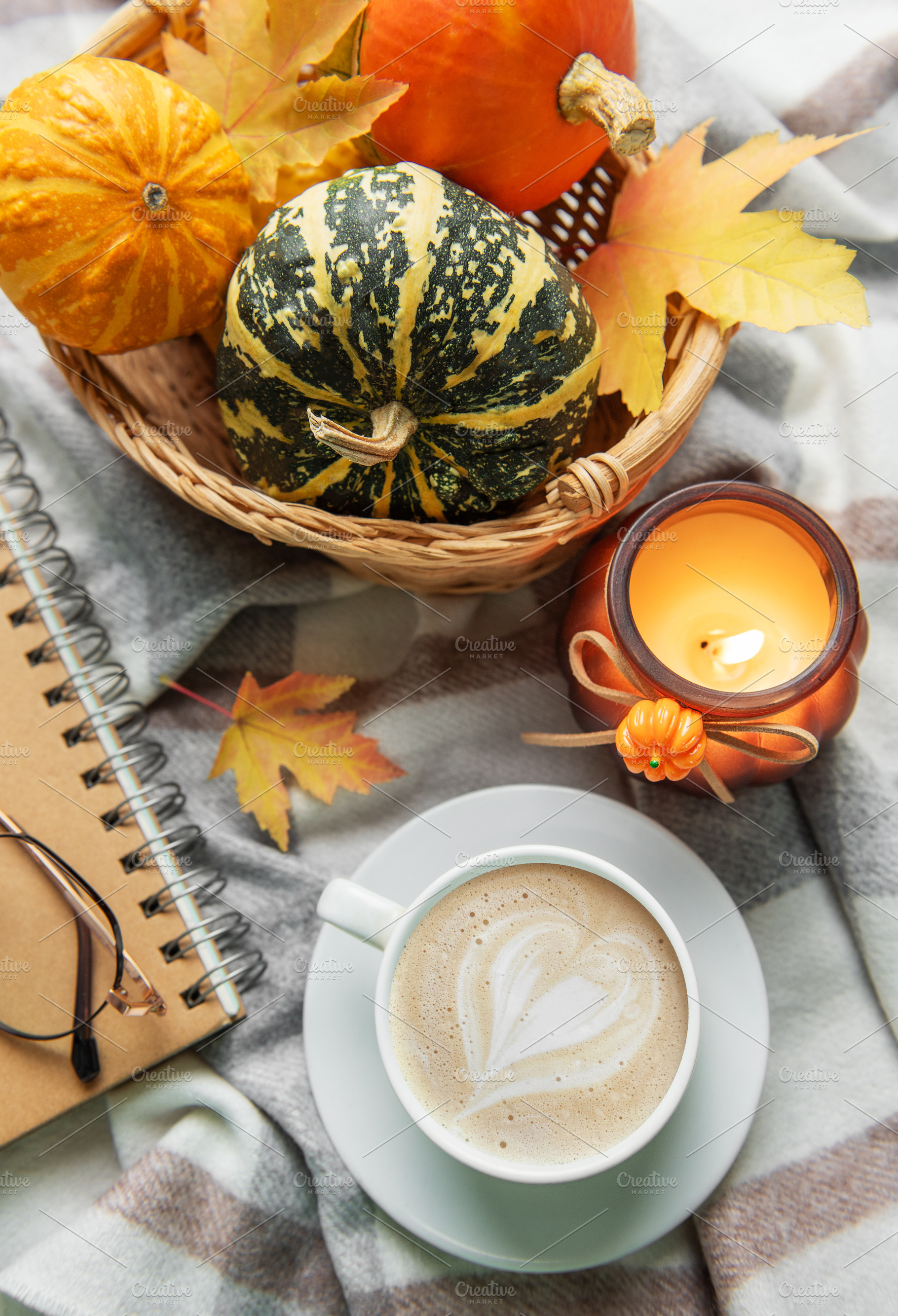 Autumn cozy moment with coffee, candle, and pumpkins, a Holiday Photo by Olena Rudo