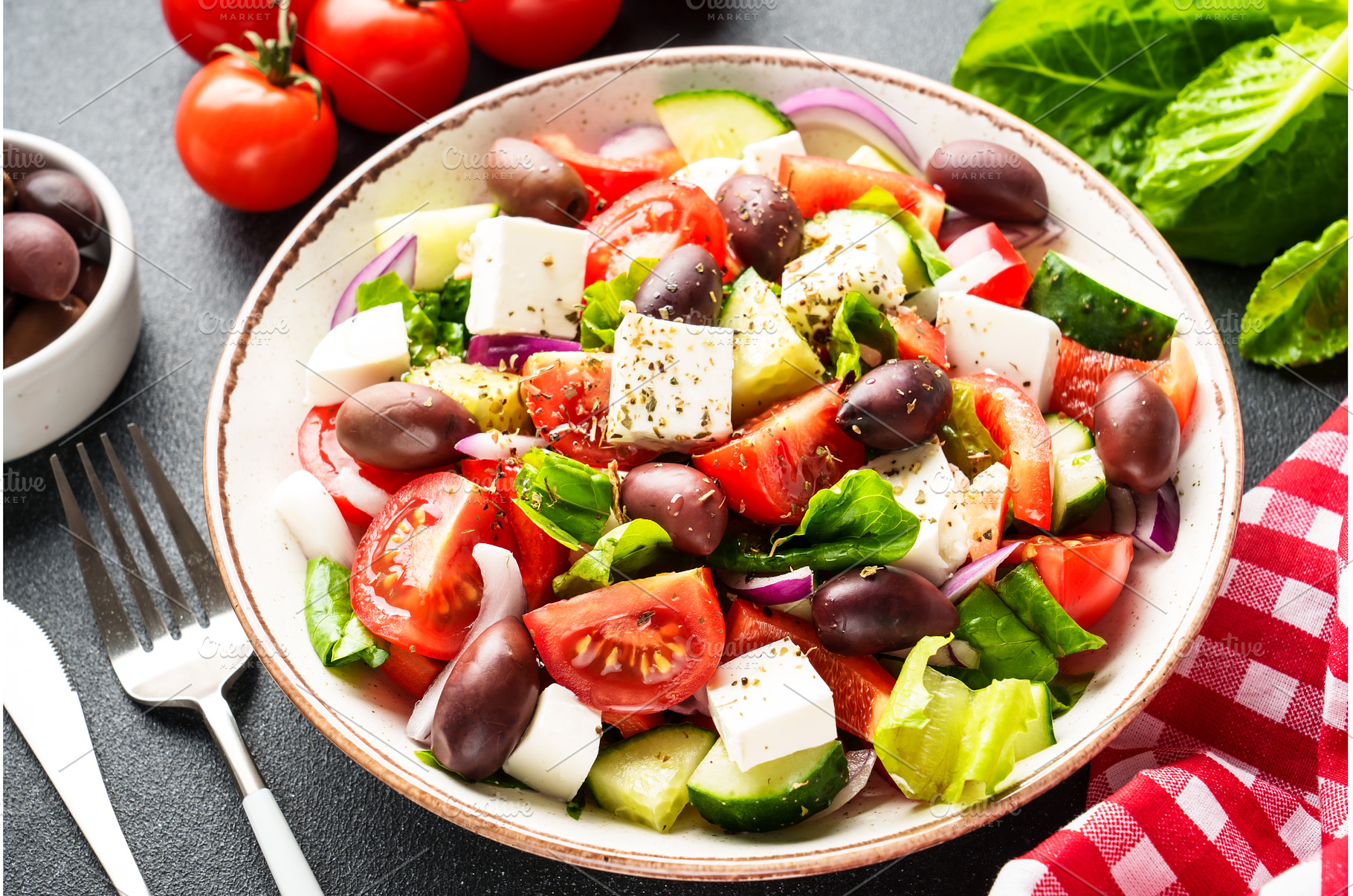 Greek salad in craft plate on black, a Food & Drink Photo by Nadia-nb