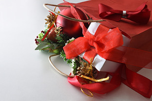 Shopping bag full of gifts on white table elevated view, a Holiday Photo by Davizro's Market
