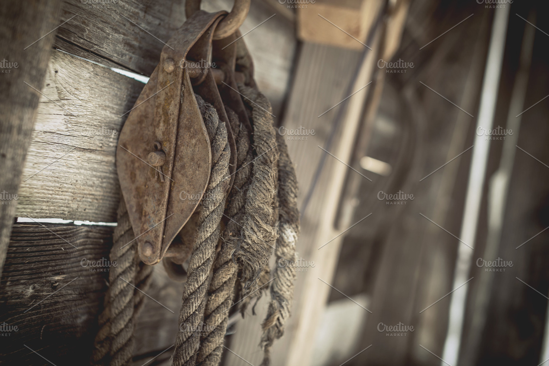 Rusty Pulley with Weathered Rope