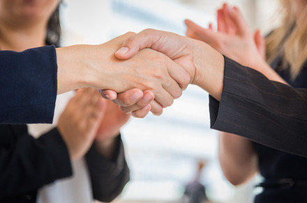 Close up of Business people shaking hands after finish agreement, a Person Photo by Ministocker