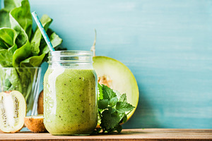 Freshly blended green fruit smoothie featuring smoothie, green, and kiwi
