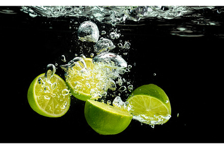 Lime Citrus Fruits splashing with, a Food & Drink Photo by MadPhotos