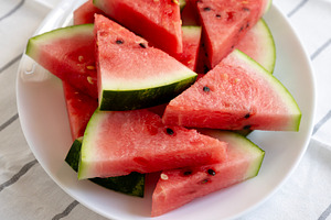 Raw Organic Watermelon Slices on a Plate, side view., a Food & Drink Photo by LiudmylaChuhunova