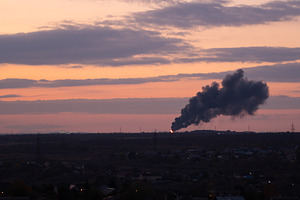 Industrial Smoke Rising Over City at, a Background Photo by Elena Vagengeim