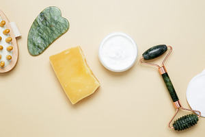 Natural beauty skincare collection featuring marble face roller, gua sha tool,