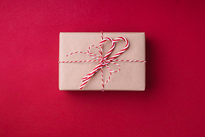 Gift box on red background featuring gift, box, and red